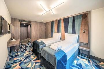 Фото номера Семейный номер, пакет услуг Holiday Отель Wellton Riverside SPA Hotel г. Рига 4