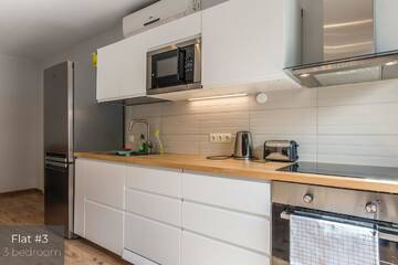 Фото номера Апартаменты с 3 спальнями и террасой Апартаменты Dandelion Apartments Lāčplēša г. Рига 5