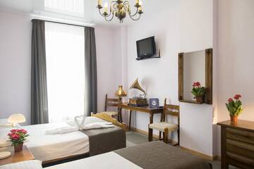 Фото номера Стандартный четырехместный номер Хостелы PatefonRooms г. Рига 3