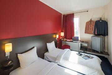 Фото номера Двухместный номер с 2 отдельными кроватями Отель Dodo Hotel г. Рига 2