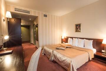 Фото номера Двухместный номер с 2 отдельными кроватями Отель Monika Centrum Hotels г. Рига 4