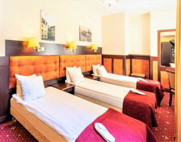 Фото номера Стандартный трехместный номер Отель Rixwell Old Riga Palace Hotel г. Рига 3